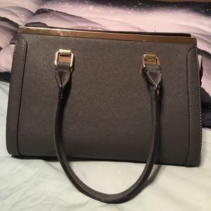 Call it Spring hard sided pleather purse